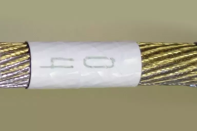 04 white colored wrapper for golden wire.